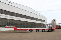 Heavy-Duty Lowbed Semi-Trailer Tversoyrmash 993941 Modification 0022 with Hydraulic Double-Folding Ramps
