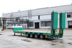 Specialized Heavy-Duty Semi-Trailer TverstroyMash 993941 Modification 0021 with Hydraulic Double-Folding Ramps